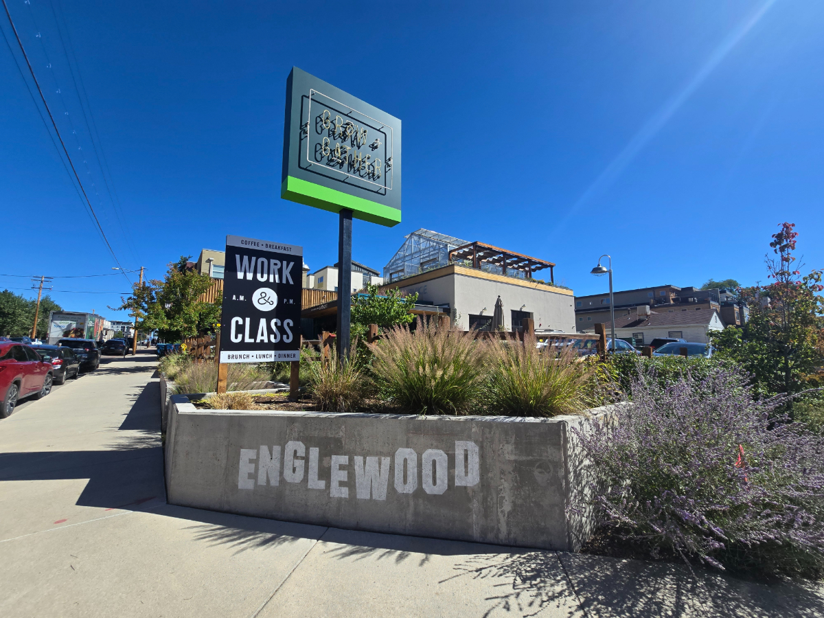 planter and sign in front of a building