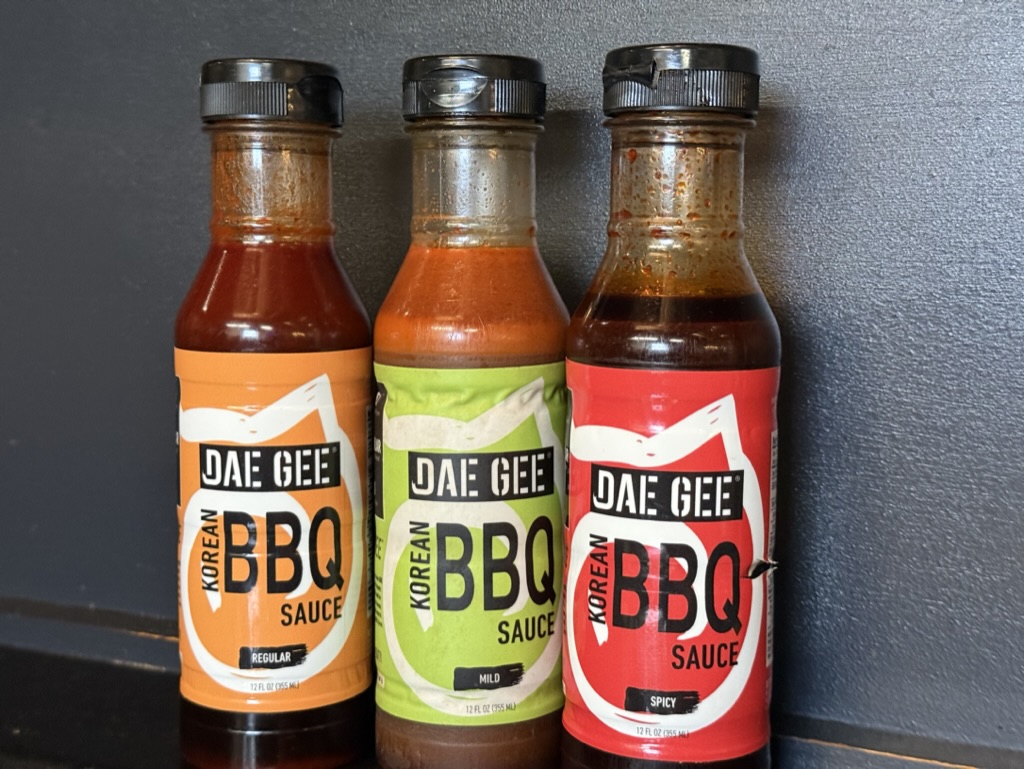 three bottles of sauces