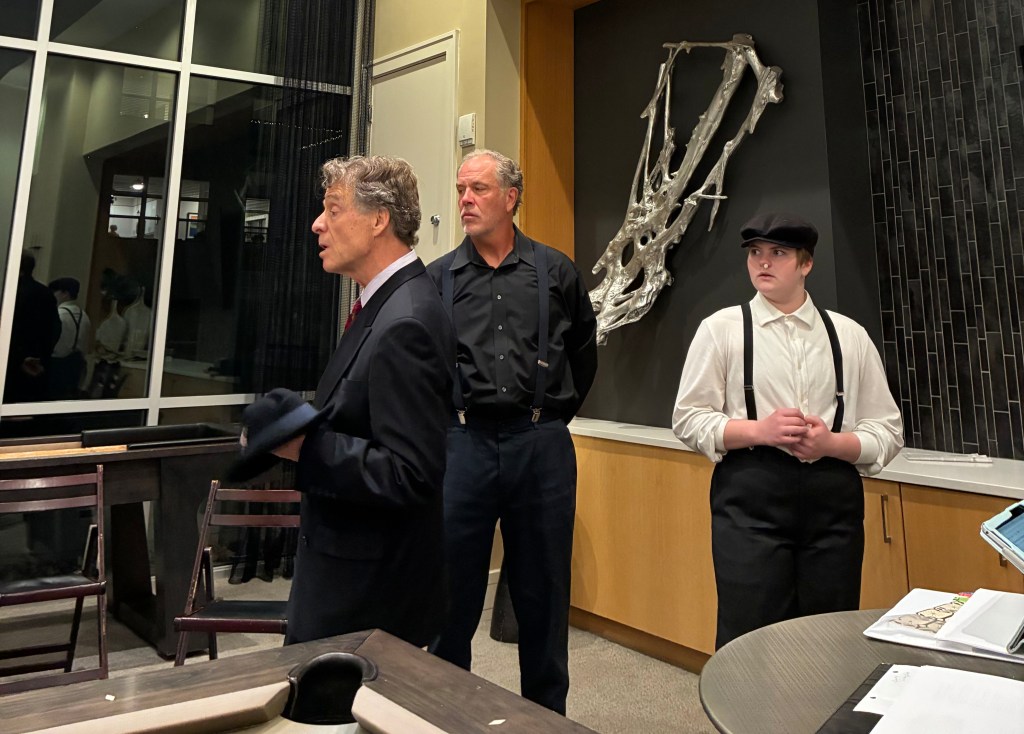 People rehearse a play.