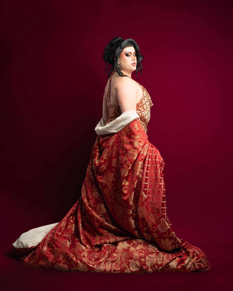 A drag queen in a red dress