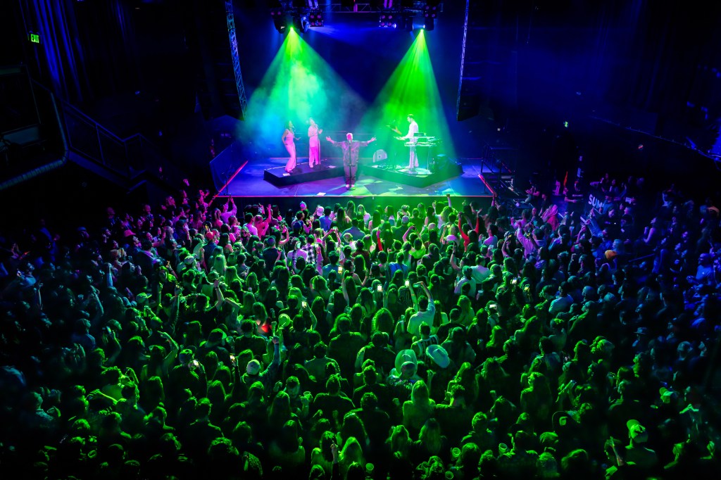 Band performs onstage.