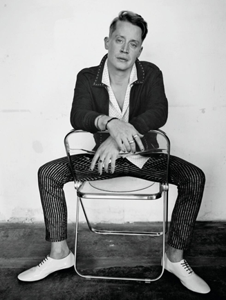 A man sits in a chair