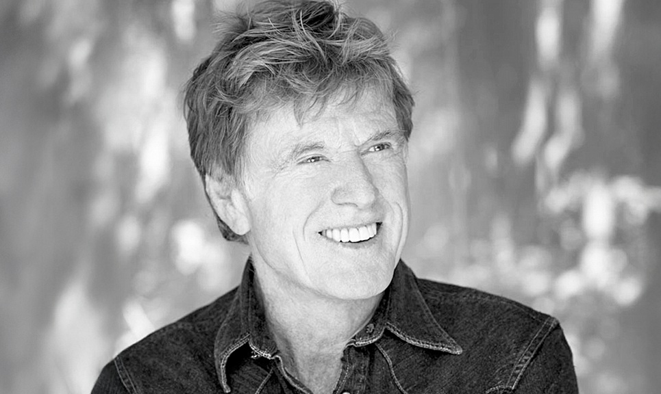 a black and white portrait of Robert Redford, founder of the Sundance Film Festival