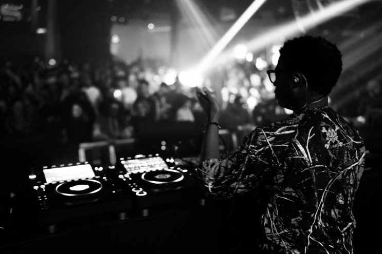 Denver DJ Sinistarr performing in front of a crowd