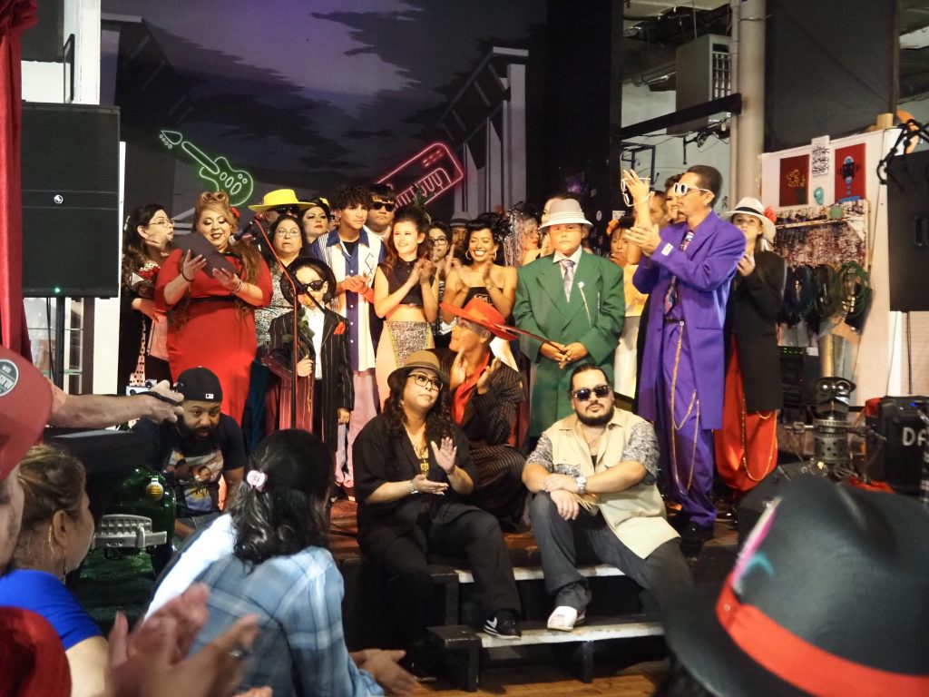 People on stage wearing zoot suits