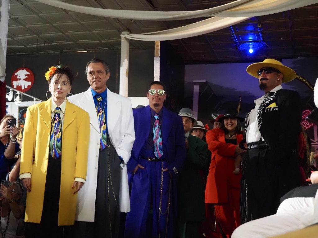 People wearing colorful zoot suits