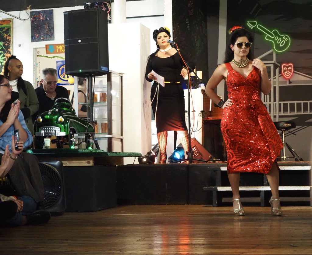 A model in a sparkly red dress