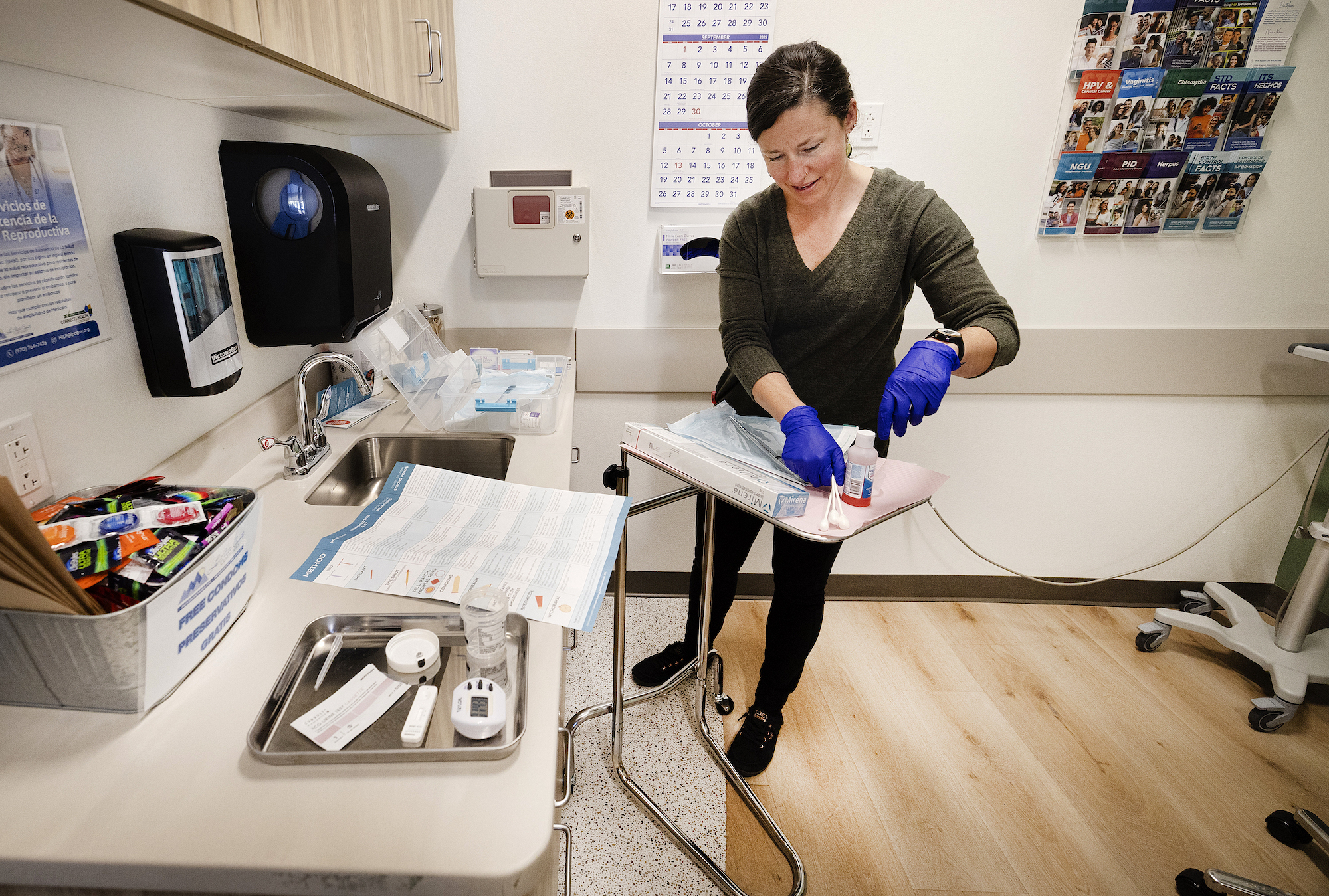 woman conduscts exam on patient