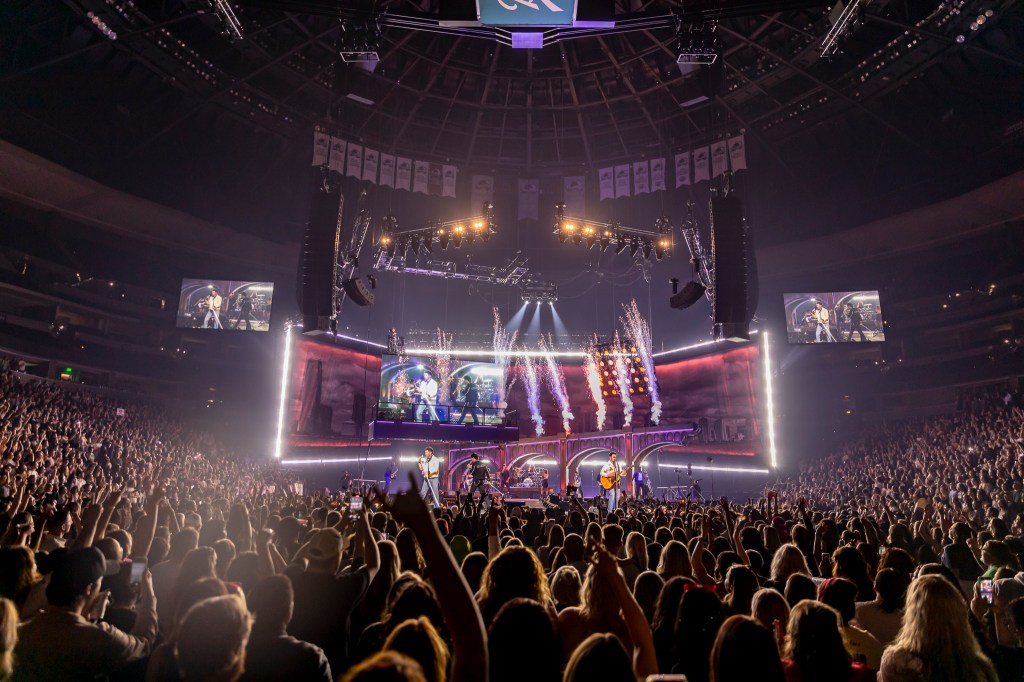 The Jonas Brothers on stage at Ball Arena in Denver, Colorado, for their JONAS20 Greetings From Your Hometown tour.