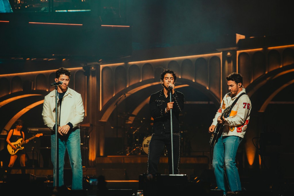 The Jonas Brothers on stage at Ball Arena in Denver, Colorado, for their JONAS20 Greetings From Your Hometown tour.