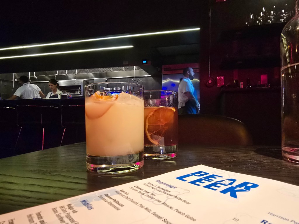 two drinks on a table in a restaurant
