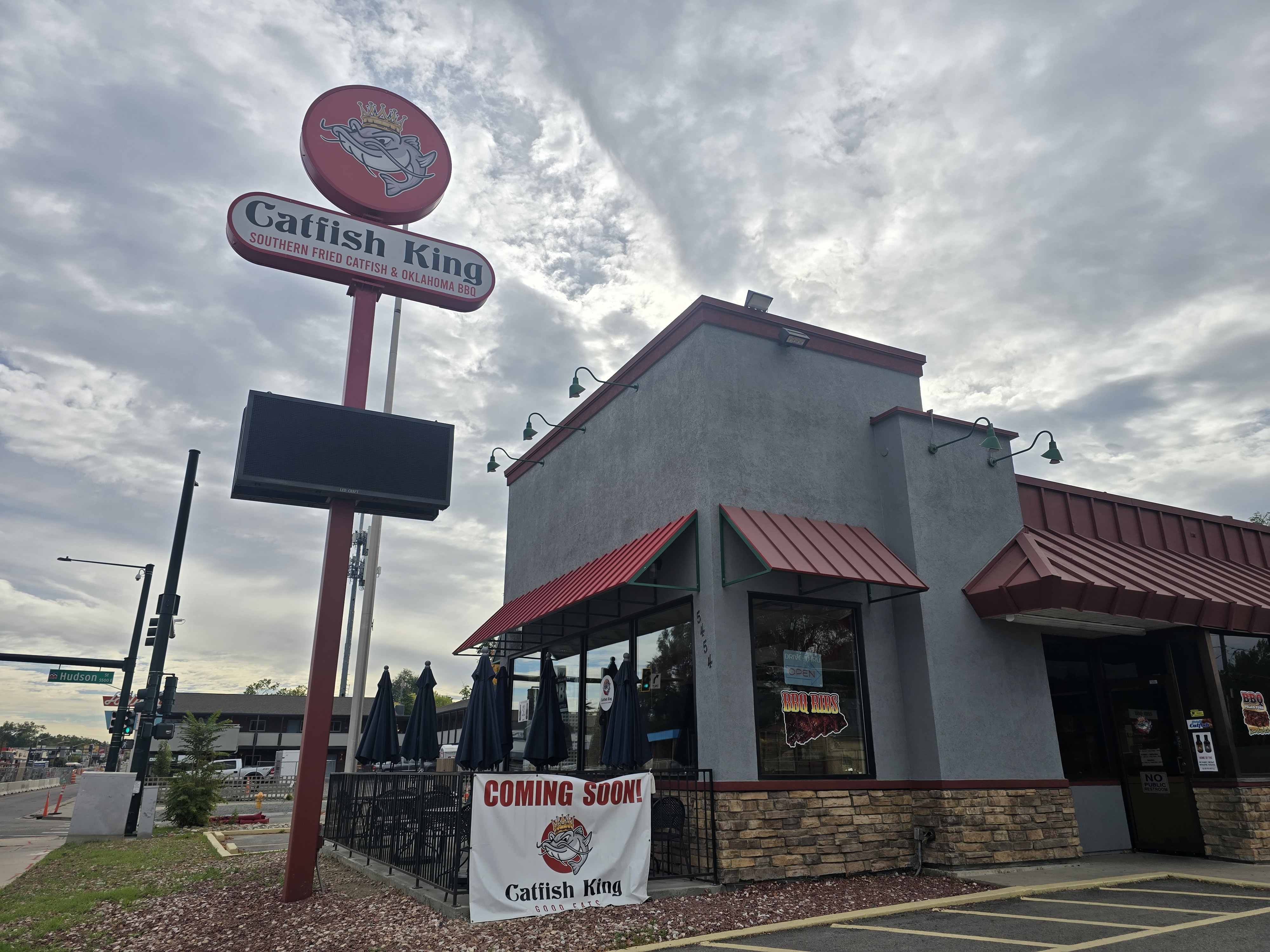grey building with a Catfish King sign in front
