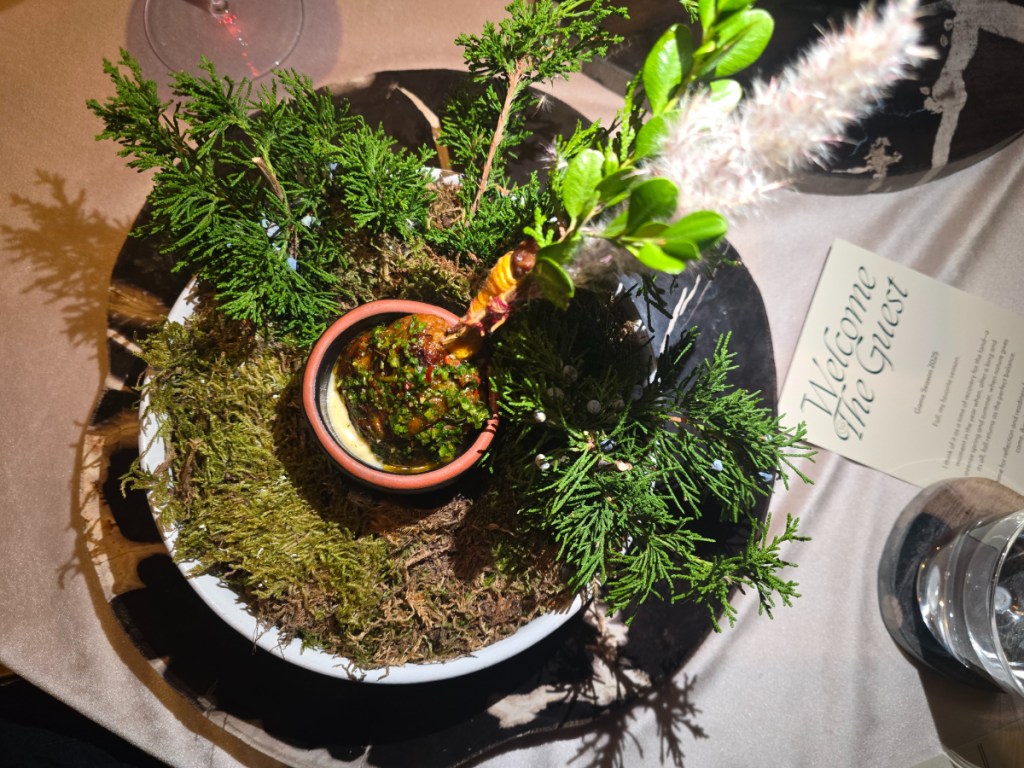 dish covered in foraged greenery