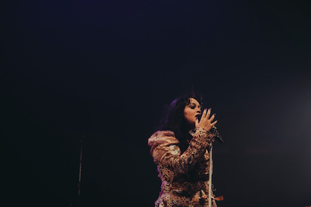 Amira Elfeky on stage at Ball Arena opening for The Plot in You.