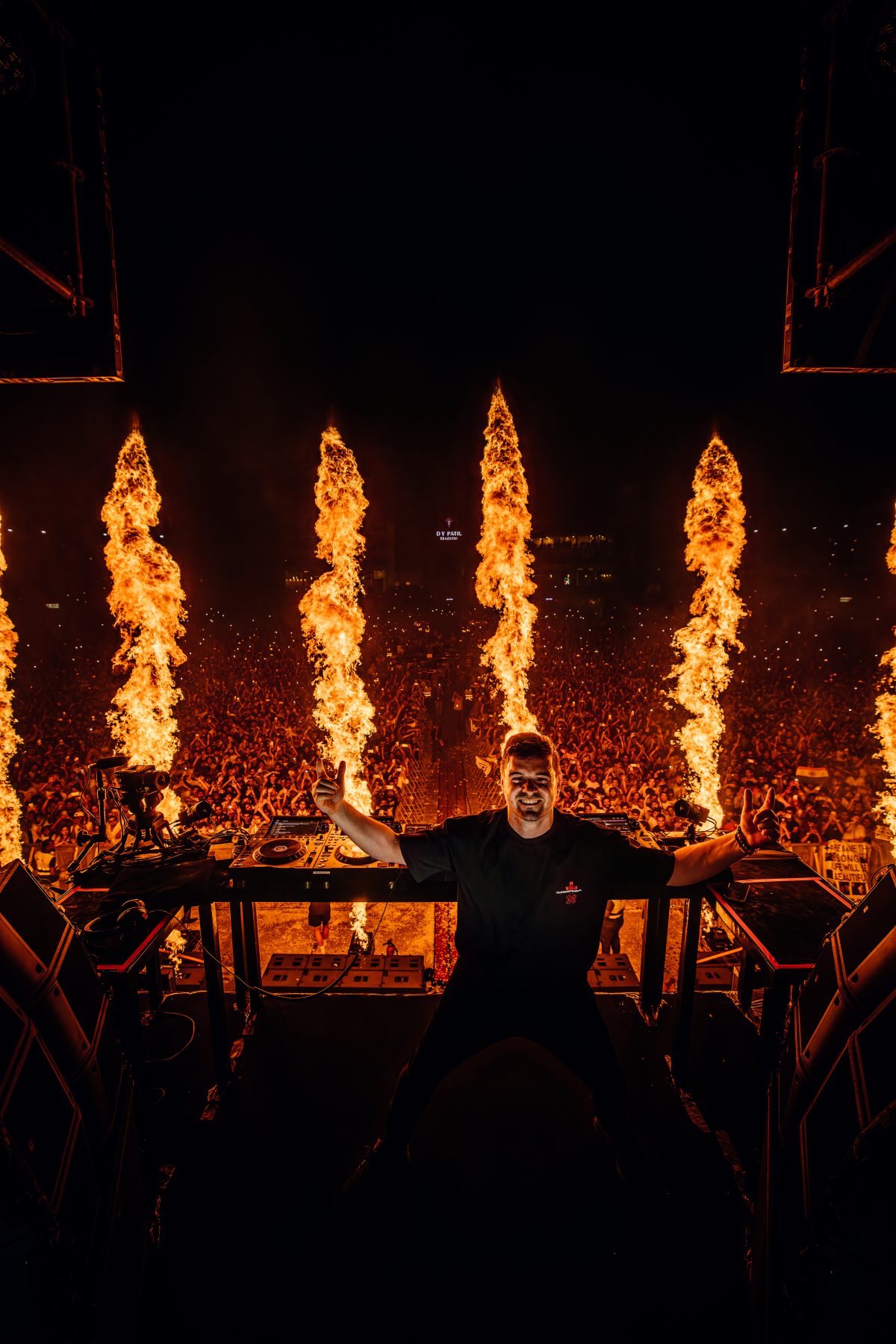 Martin Garrix dj'ing in front of pyrotechnics
