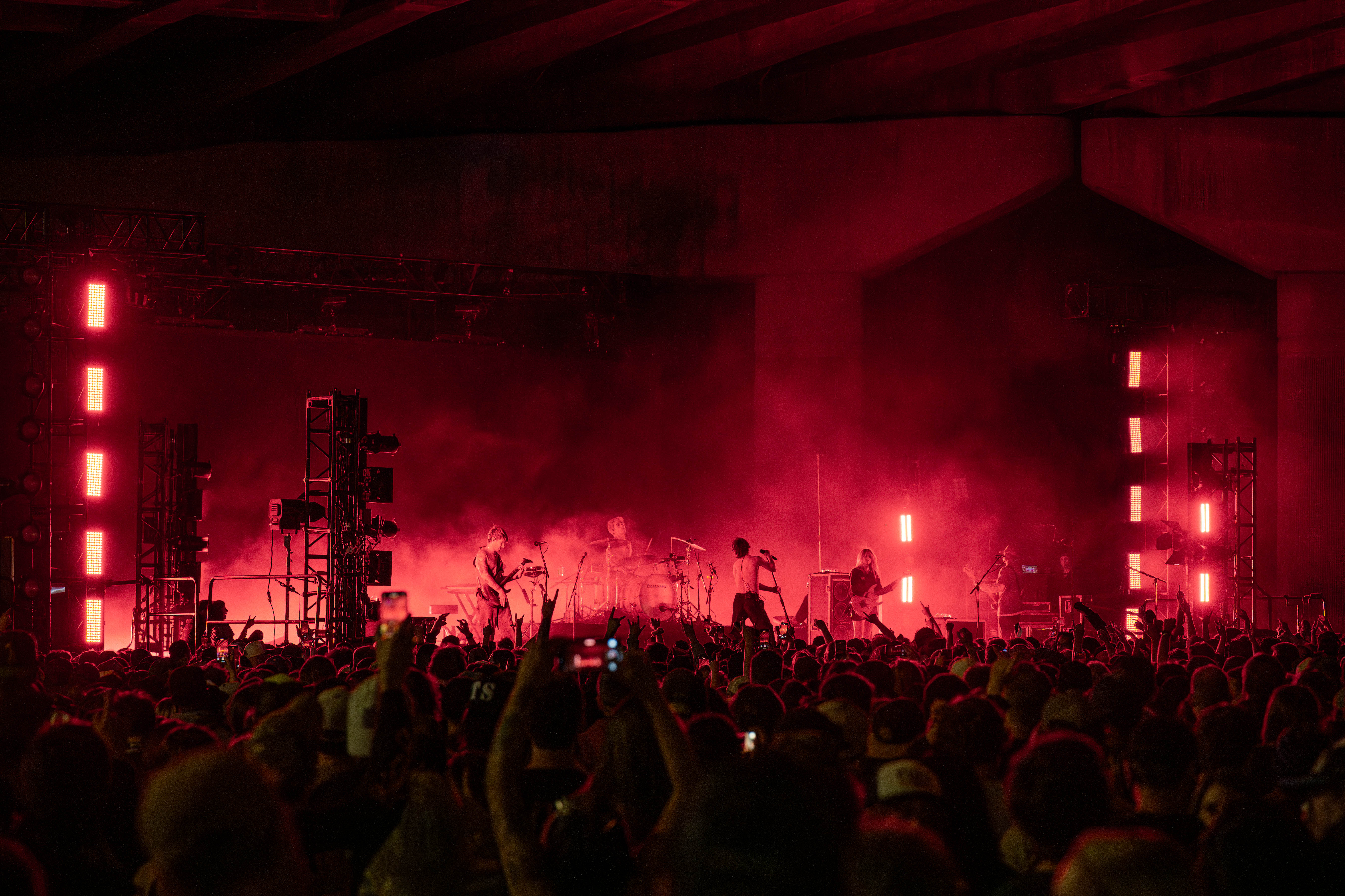 Turnstile playing in Denver under a bridge