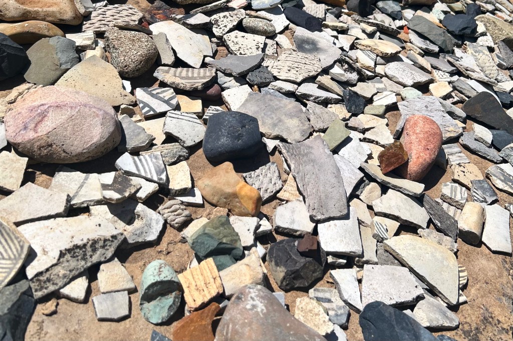 A pile of colorful stones and painted pottery shards at Ute Mountain Tribal Park