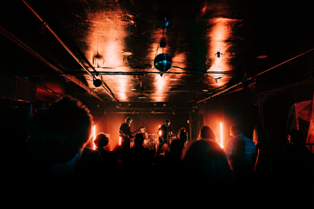 band on stage in an indoor venue
