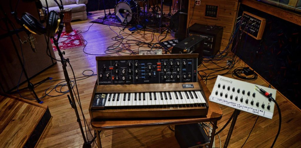 a studio recording room and keyboard