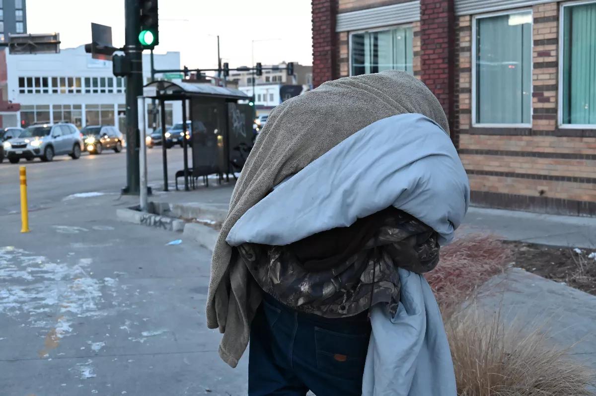 homeless man with blanket