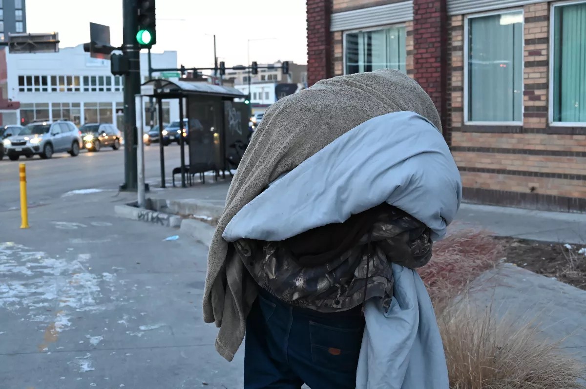 homeless man with blanket