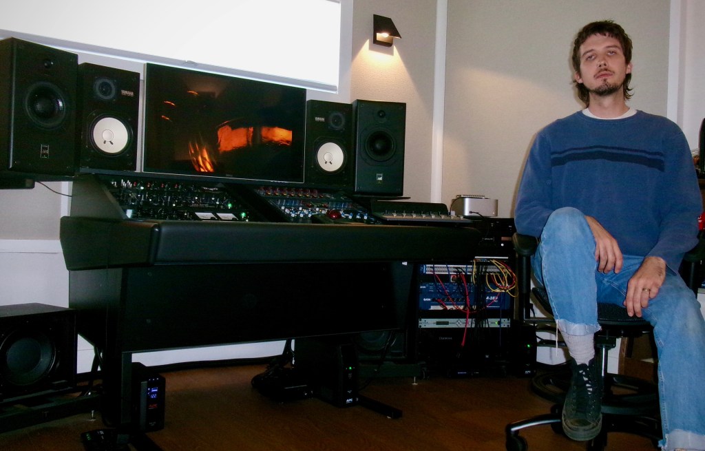 a studio mixing console and audio engineer