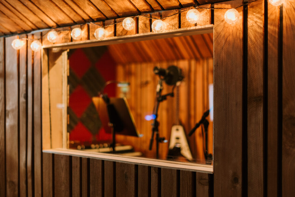 a studio recording room from the control room