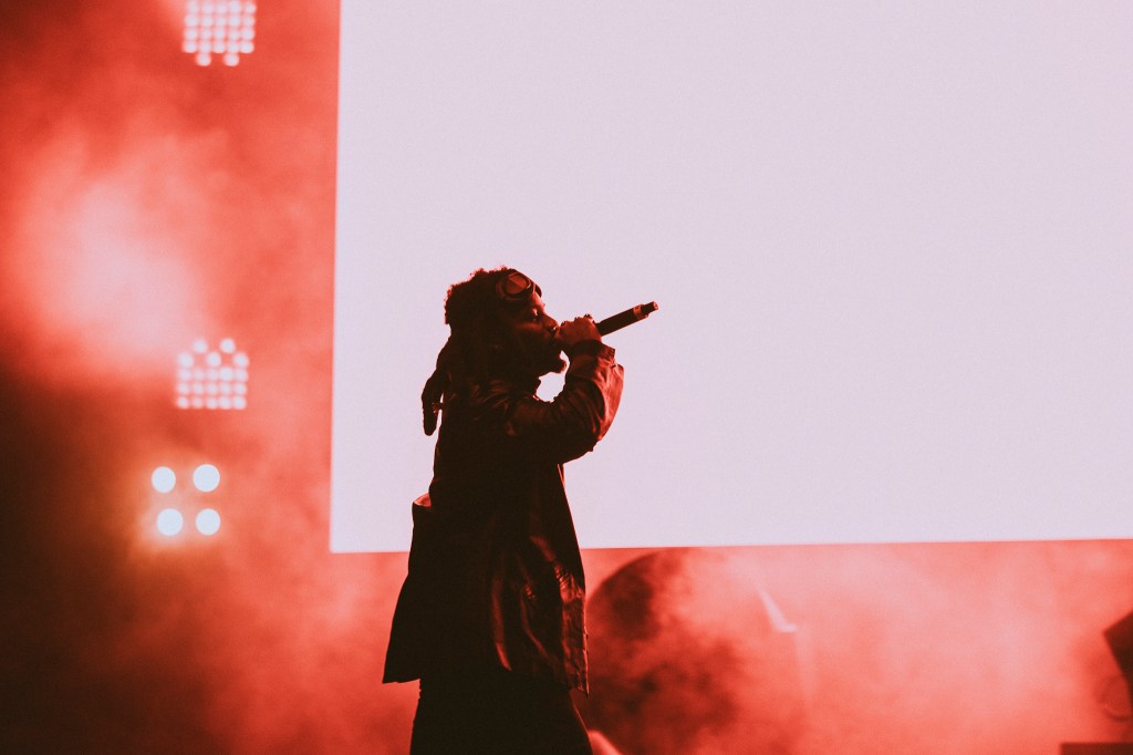 A photo showing Denzel Curry on stage at Red Rocks on October 31 for Halloween on the Rocks.