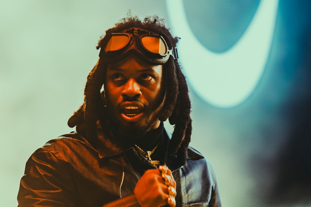 A photo showing Denzel Curry on stage at Red Rocks on October 31 for Halloween on the Rocks.
