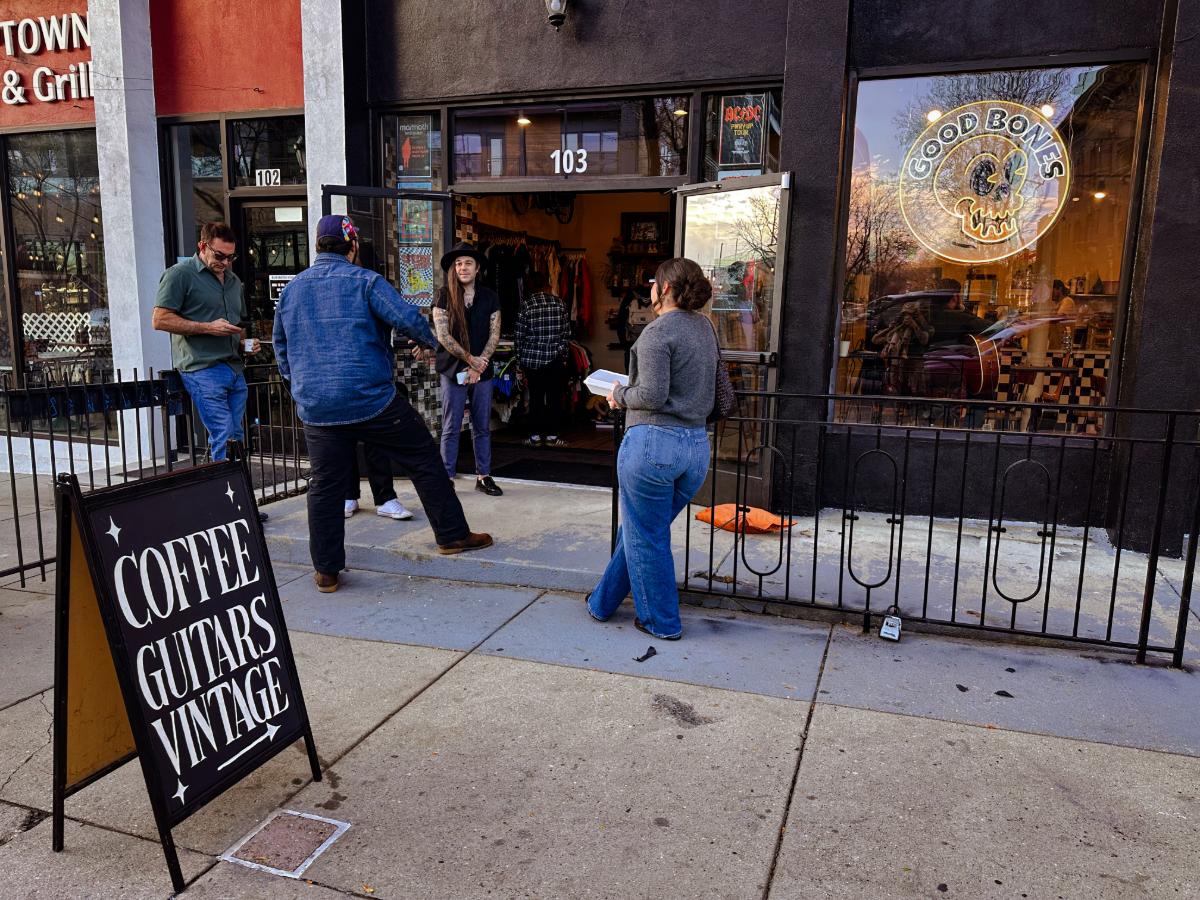 people standing in front of a coffee shop
