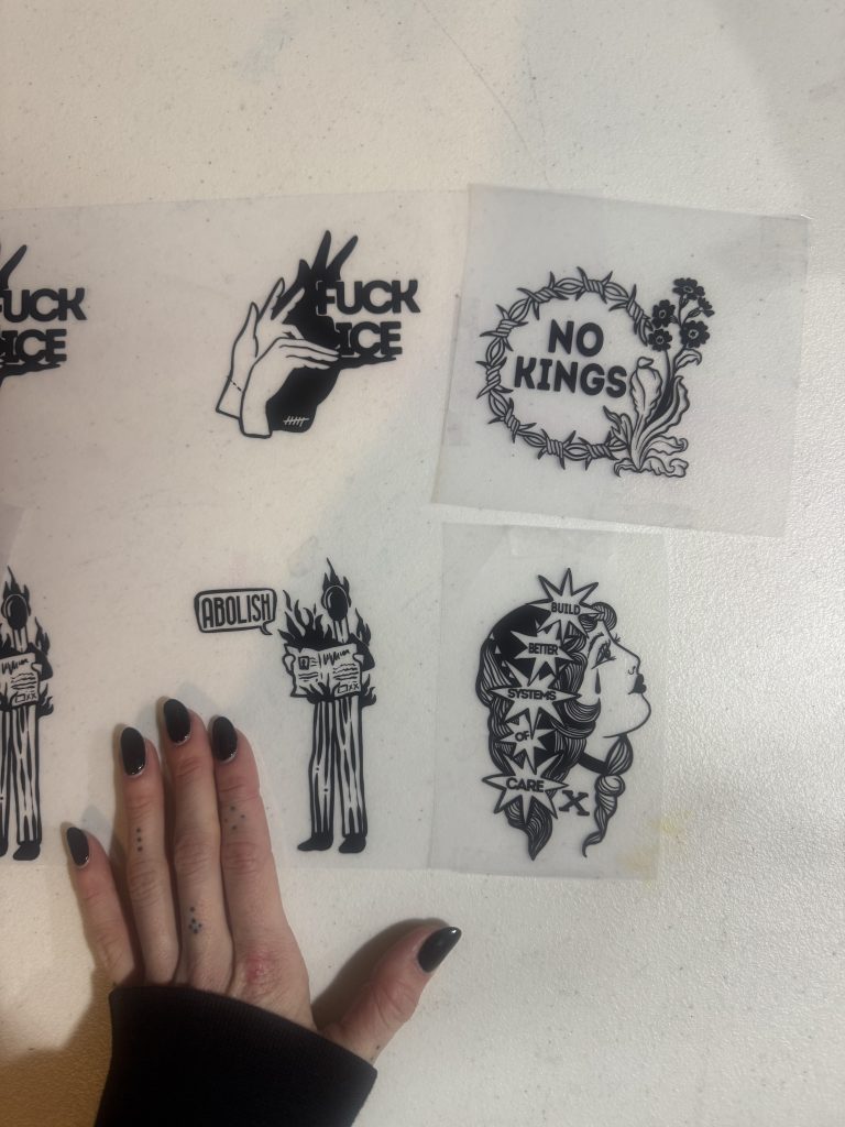 patches that say "No Kings" and "Fuck ICE"