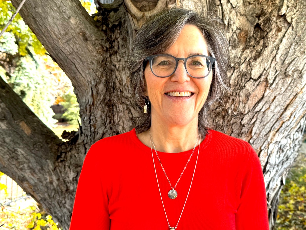 a portrait of a woman in a red shirt