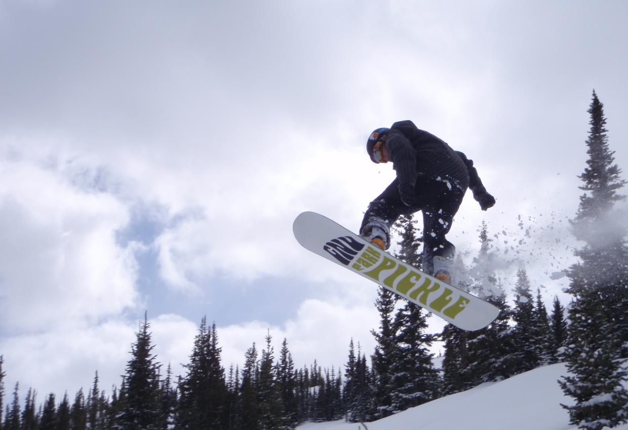 snowboarder catches air in breckenridge