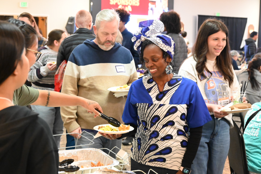 immigrants enjoy Thanksgiving meal in denver