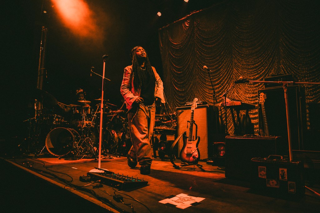 Ambré on stage at the Summit Music Hall in Denver, Colorado.