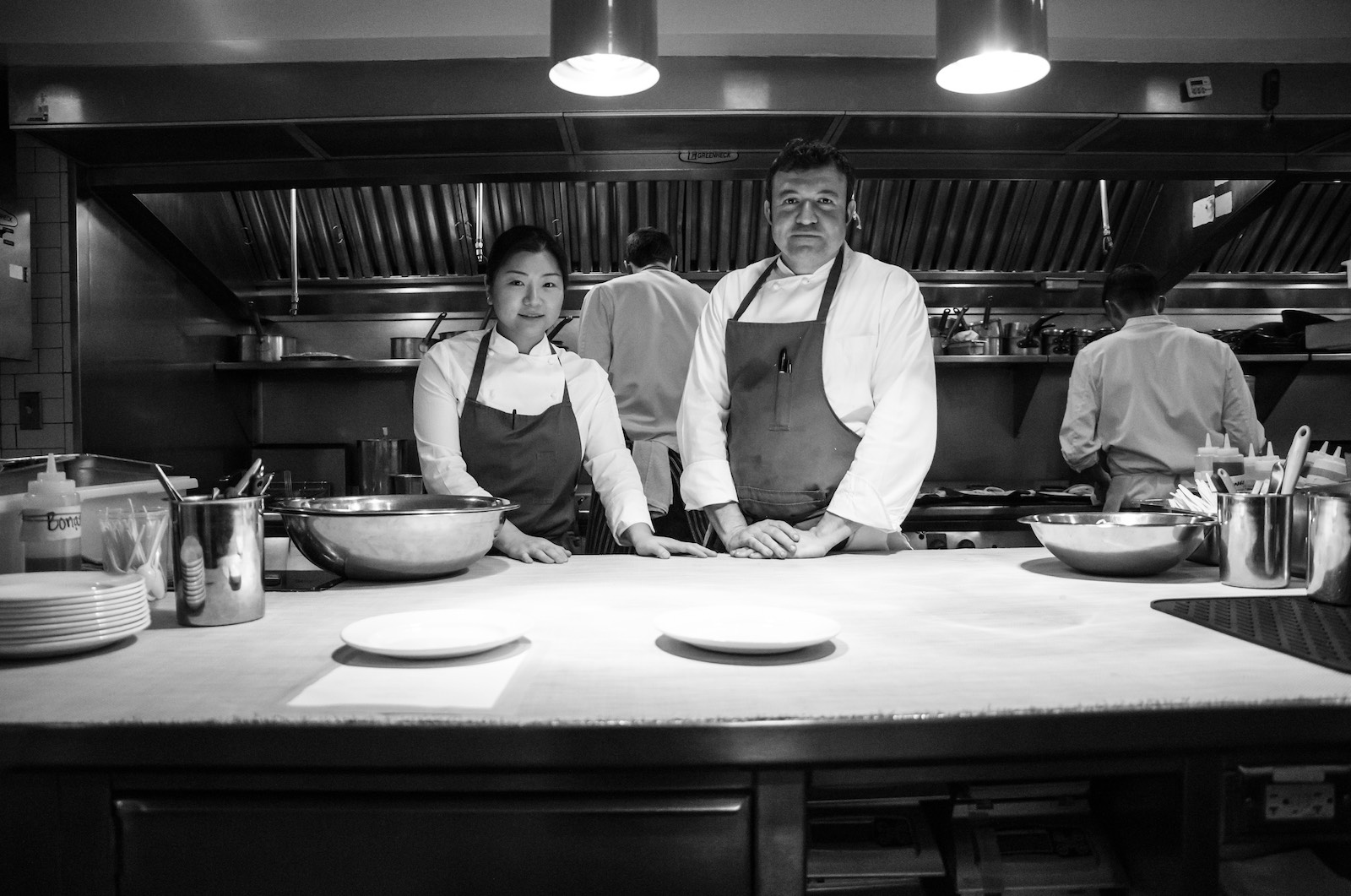 two chefs in a kitchen