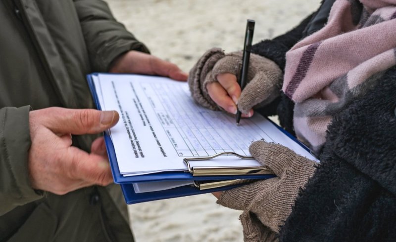 signature gather hands over petition