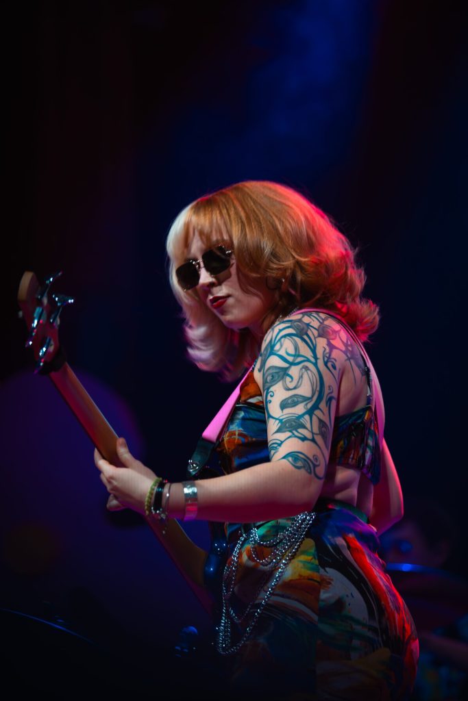 woman playing bass