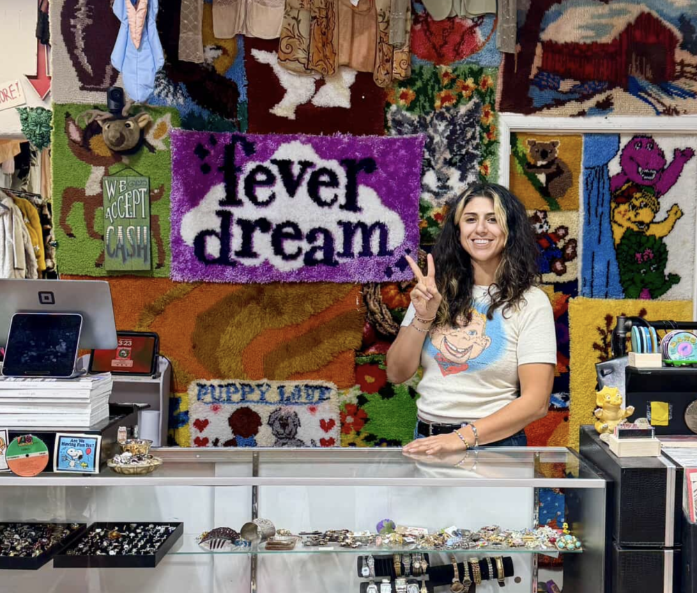 A person stands behind a counter of a store