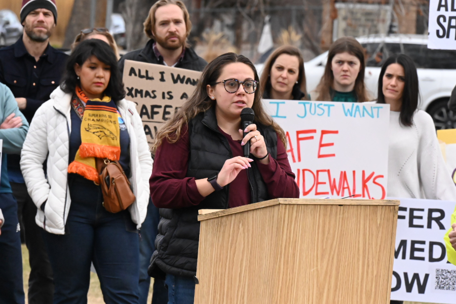 woman speaks at denver rally