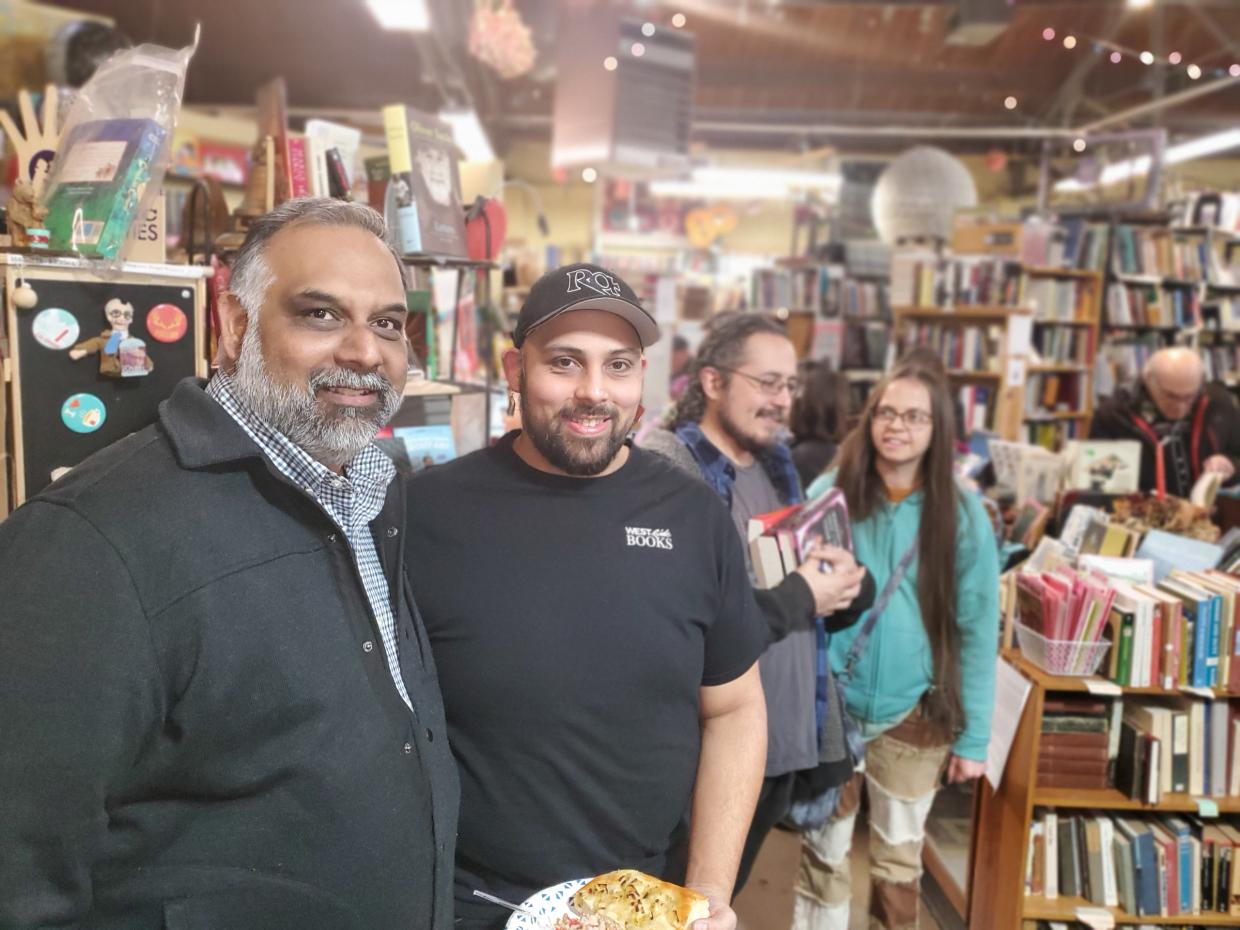 people stand in a book store