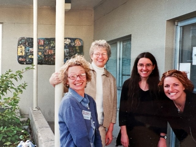 Four women pose outside of DAVA