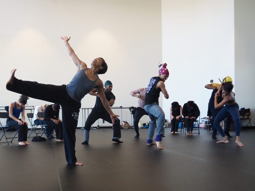 dancers kick and lunge