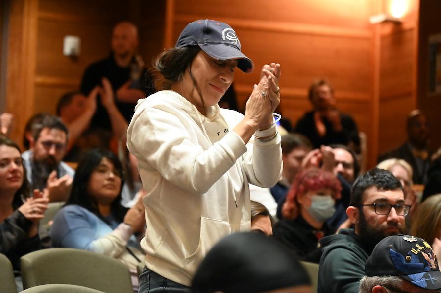 people clap at council meeting