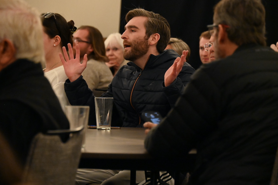 man speaks during town hall