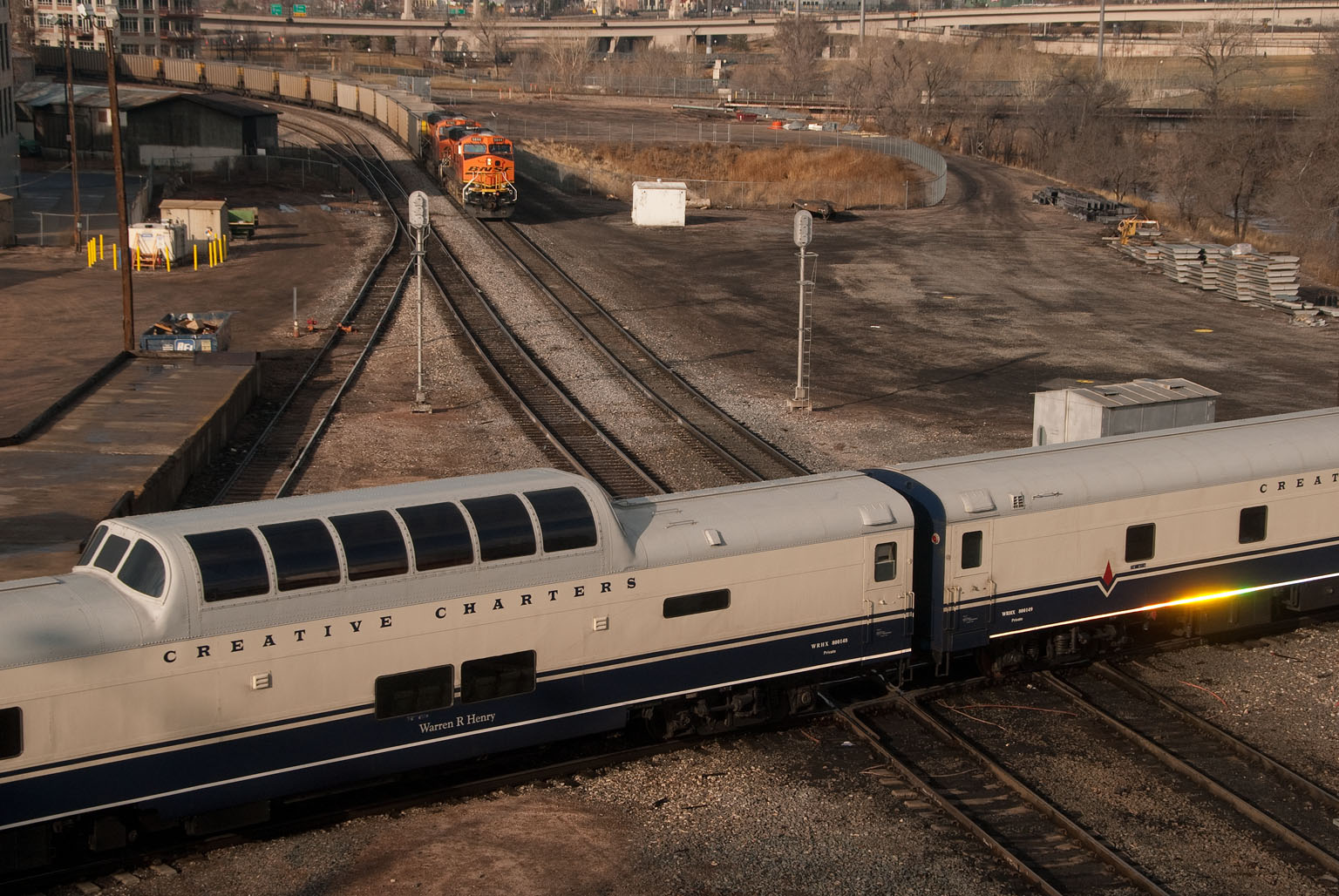 dome train car travels through town