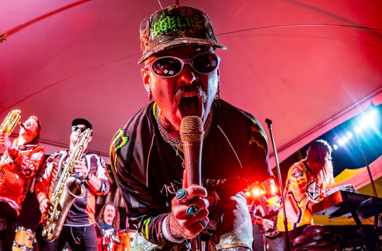 man singing into mic