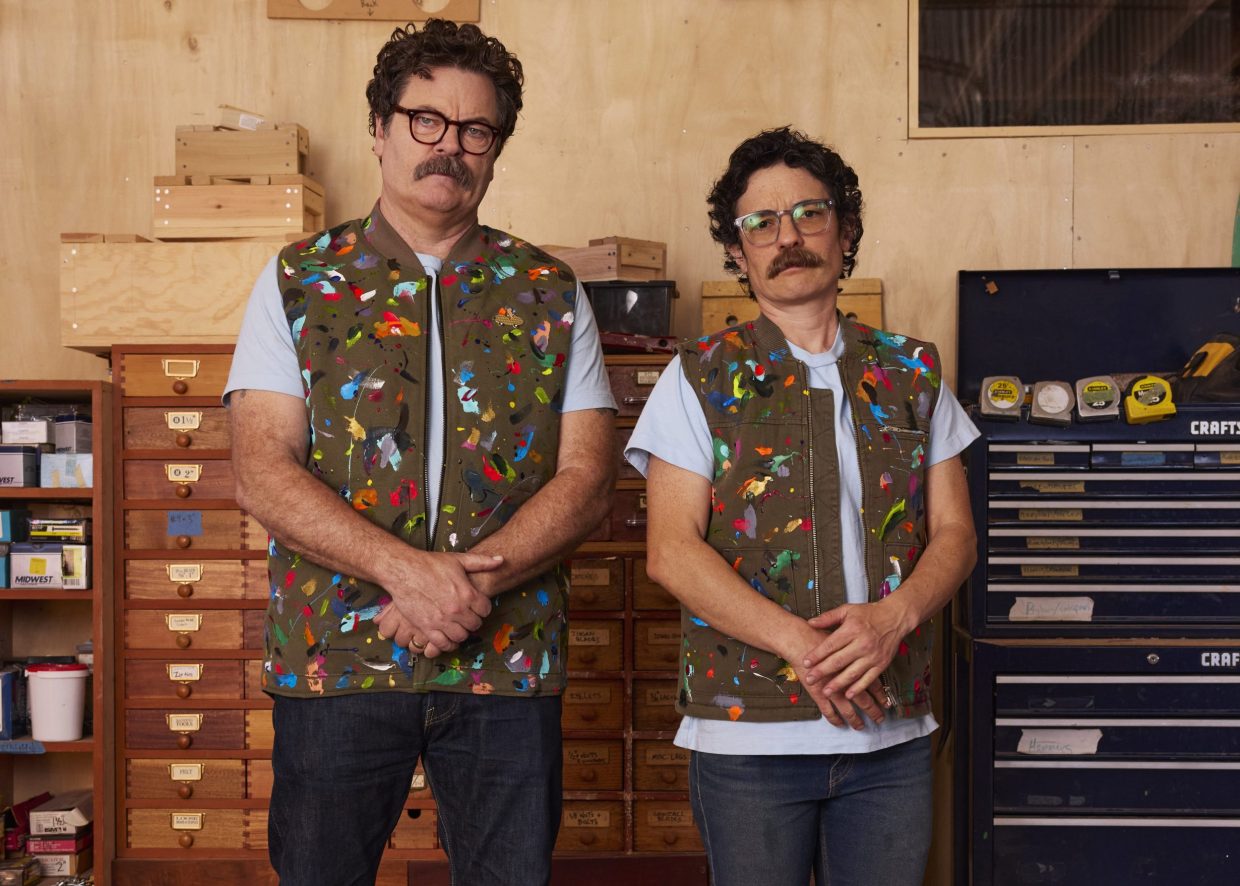 Two people post for a photo