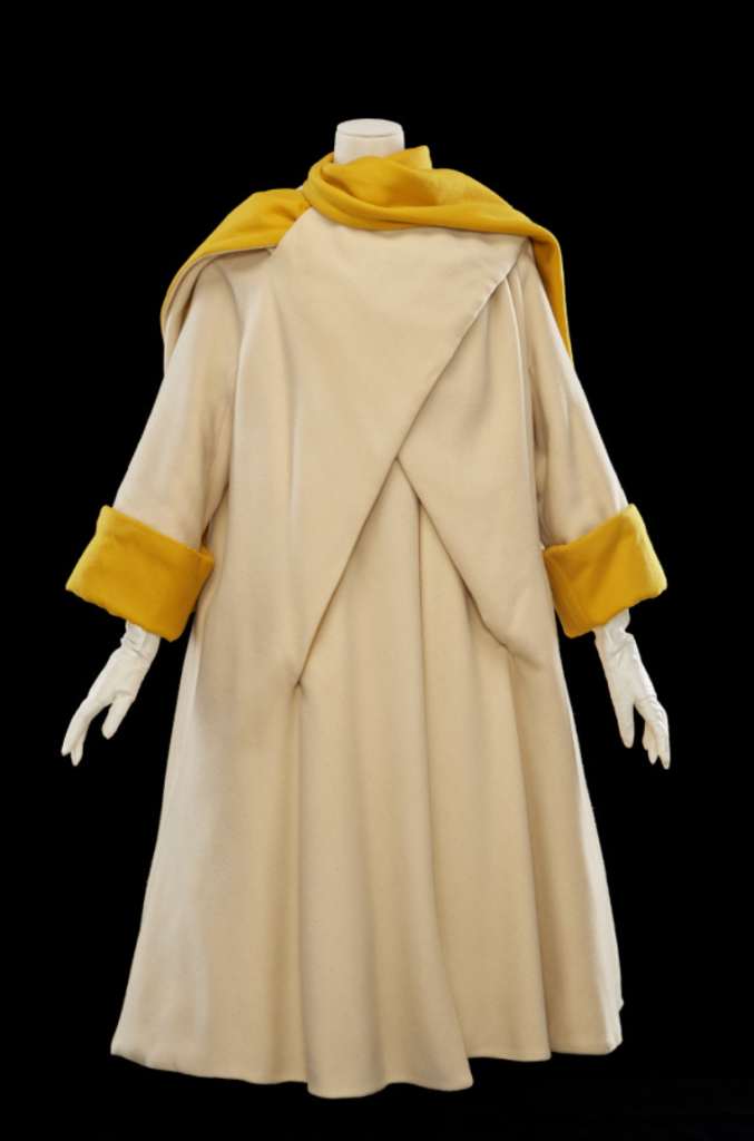 A yellow and cream coat