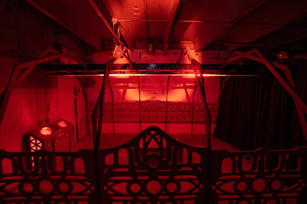 A red light washes over a room